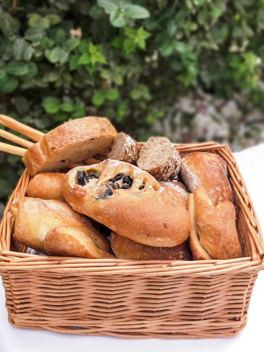 assorted bread, italian bread, french wine, casa mia, le meridian dubai